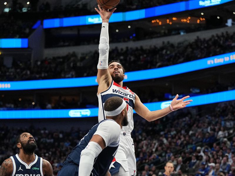 DALLAS, TX - FEBRUARY 12: Tyus Jones #5 of the Washington Wizards drives to the basket during the game again the Dallas Mavericks on February 12, 2024 at the American Airlines Center in Dallas, Texas. NOTE TO USER: User expressly acknowledges and agrees that, by downloading and or using this photograph, User is consenting to the terms and conditions of the Getty Images License Agreement. Mandatory Copyright Notice: Copyright 2024 NBAE (Photo by Glenn James/NBAE via Getty Images)