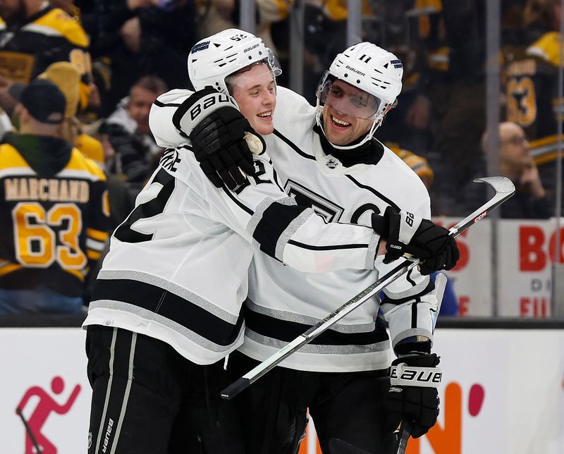 Feb 17, 2024; Boston, Massachusetts, USA; Los Angeles Kings center Anze Kopitar (11) hugs defenseman Brandt Clarke (92) after his overtime goal gave the Kings a 5-4 win over the Boston Bruins at TD Garden. Mandatory Credit: Winslow Townson-USA TODAY Sports