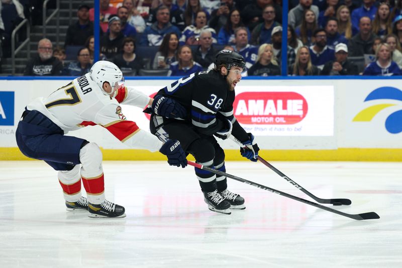 Feb 17, 2024; Tampa, Florida, USA;  Tampa Bay Lightning left wing Brandon Hagel (38) controls the puck against the Florida Panthers in the first period at Amalie Arena. Mandatory Credit: Nathan Ray Seebeck-USA TODAY Sports