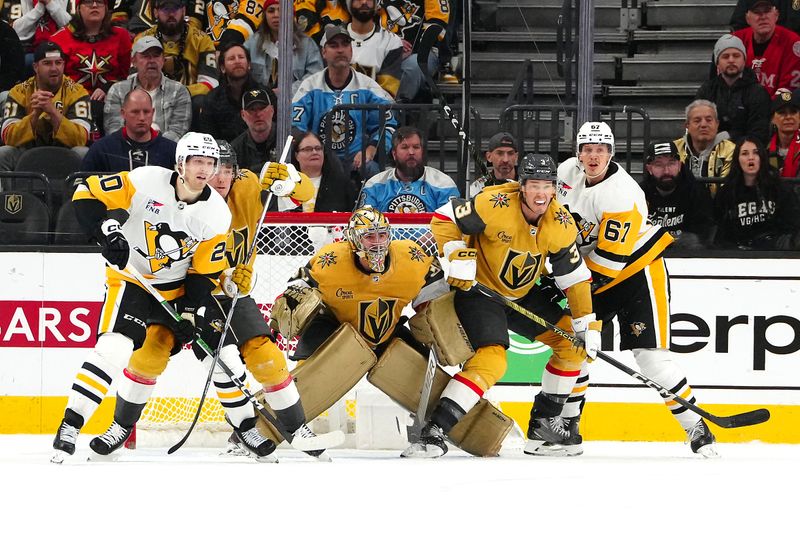 Jan 20, 2024; Las Vegas, Nevada, USA; Vegas Golden Knights goaltender Logan Thompson (36) defends his net between Vegas Golden Knights defenseman Zach Whitecloud (2) and Vegas Golden Knights defenseman Brayden McNabb (3) during a Pittsburgh Penguins power play during the third period at T-Mobile Arena. Mandatory Credit: Stephen R. Sylvanie-USA TODAY Sports