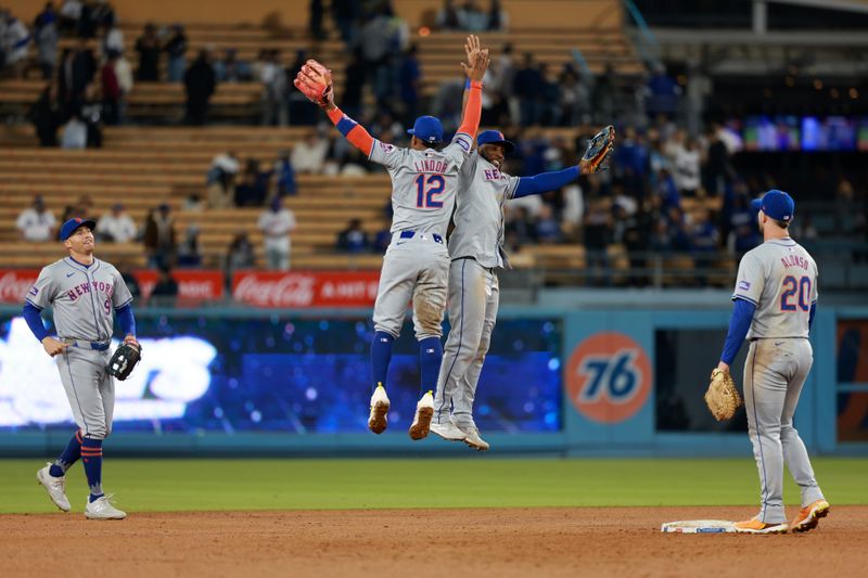 Apr 19, 2024; Los Angeles, California, USA;  New York Mets shortstop Francisco Lindor (12) and outfielder Starling Marte (6) celebrate a victory after defeating the Los Angeles Dodgers 9-4 at Dodger Stadium. Mandatory Credit: Kiyoshi Mio-USA TODAY Sports