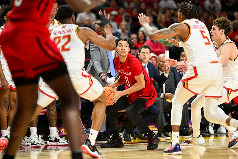 Feb 6, 2024; College Park, Maryland, USA; Rutgers Scarlet Knights guard Derek Simpson (0) looks to pass while Maryland Terrapins defense swarms during the second half  at Xfinity Center. Mandatory Credit: Tommy Gilligan-USA TODAY Sports