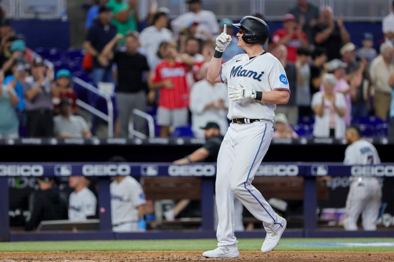 Jul 30, 2023; Miami, Florida, USA; Miami Marlins designated hitter Garrett Cooper (26) crosses home plate after hitting a two-run home run against the Detroit Tigers during the seventh inning at loanDepot Park. Mandatory Credit: Sam Navarro-USA TODAY Sports