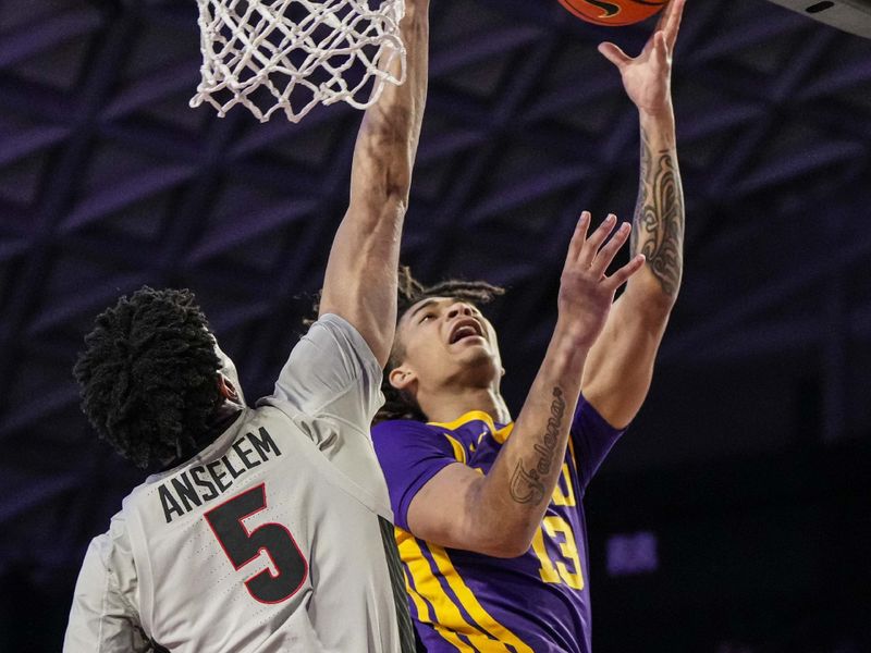 Feb 14, 2023; Athens, Georgia, USA; LSU Tigers forward Jalen Reed (13) shoots against Georgia Bulldogs center Frank Anselem (5) during the first half at Stegeman Coliseum. Mandatory Credit: Dale Zanine-USA TODAY Sports