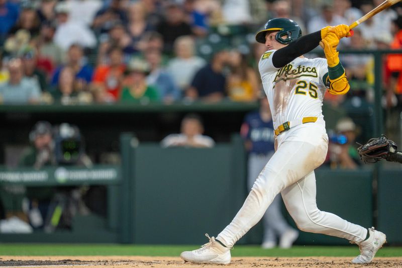 May 6, 2025; West Sacramento, California, USA;   Athletics designated hitter Brent Rooker (25) hits a RBI single against the Seattle Mariners during the third inning at Sutter Health Park. Mandatory Credit: Neville E. Guard-Imagn Images