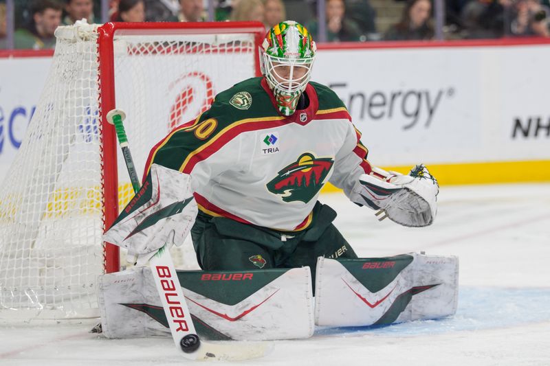 Dec 21, 2025; Saint Paul, Minnesota, USA; Minnesota Wild goaltender Jesper Wallstedt (30) makes a stick save against the Colorado Avalanche in the second period at Grand Casino Arena. Mandatory Credit: Matt Blewett-Imagn Images