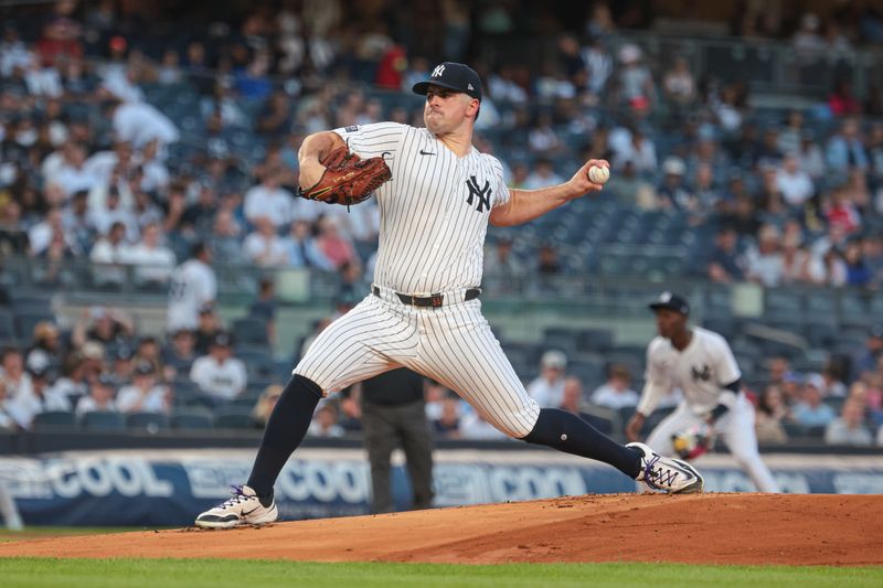 Aug 23, 2024; Bronx, New York, USA; New York Yankees starting pitcher Carlos Rodon (55) delivers a pitch during the first inning against the Colorado Rockies at Yankee Stadium. Mandatory Credit: Vincent Carchietta-USA TODAY Sports