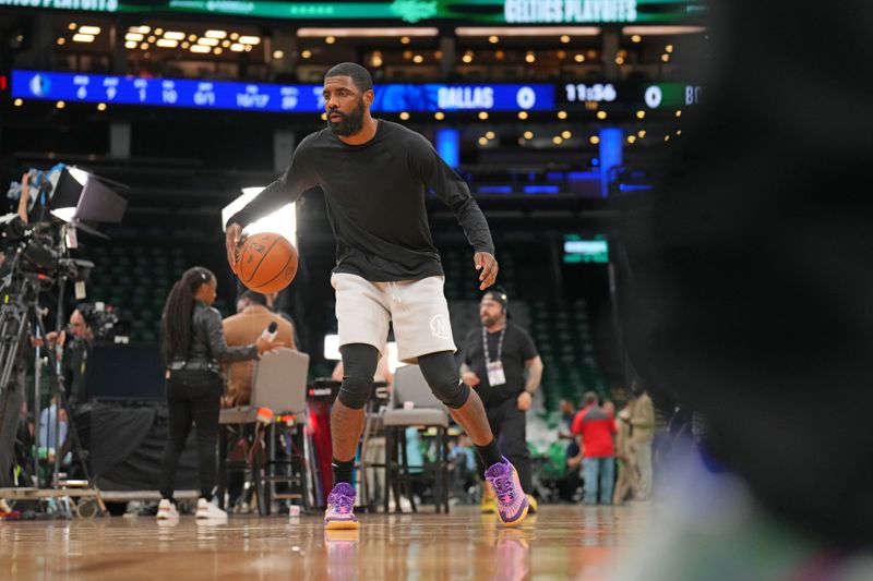 BOSTON, MA - JUNE 6: Kyrie Irving #11 of the Dallas Mavericks warms up before the game against the Boston Celtics during Game 1 of the 2024 NBA Finals on June 6, 2024 at the TD Garden in Boston, Massachusetts. NOTE TO USER: User expressly acknowledges and agrees that, by downloading and or using this photograph, User is consenting to the terms and conditions of the Getty Images License Agreement. Mandatory Copyright Notice: Copyright 2024 NBAE  (Photo by Jesse D. Garrabrant/NBAE via Getty Images)