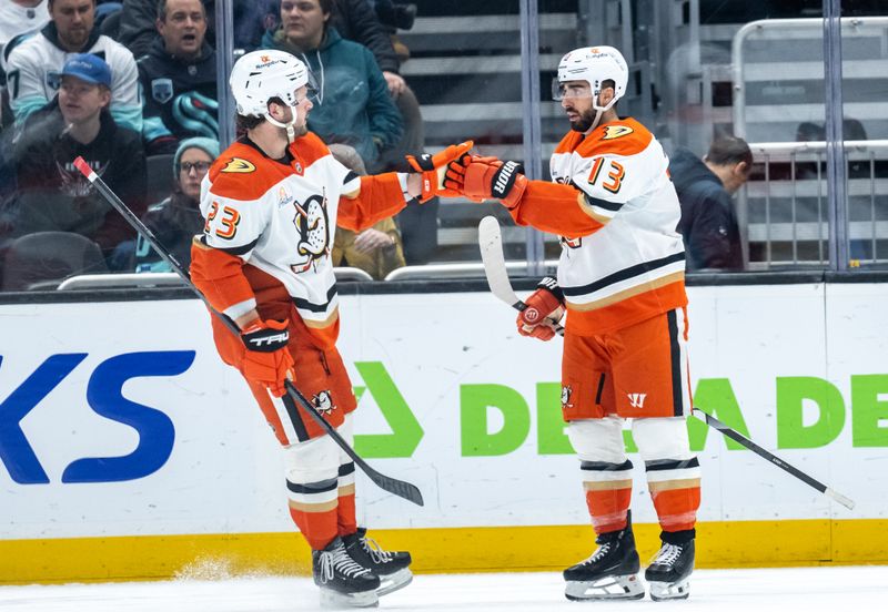 Jan 28, 2025; Seattle, Washington, USA;  Anaheim Ducks forward Mason McTavish (23) and forward Robby Fabbri (13) celebrate a goal during the second period against the Seattle Kraken at Climate Pledge Arena. Mandatory Credit: Stephen Brashear-Imagn Images