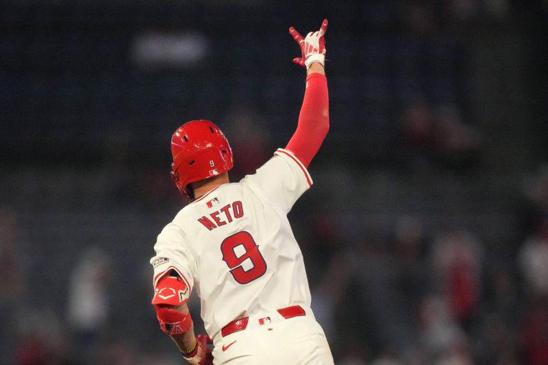 Jul 10, 2024; Anaheim, California, USA; Los Angeles Angels shortstop Zach Neto (9) celebrates after hitting a two-run home run in the eighth inning against the Texas Rangers at Angel Stadium. Mandatory Credit: Kirby Lee-USA TODAY Sports