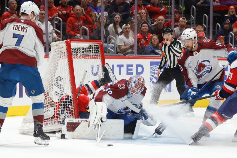 Mar 22, 2026; Washington, District of Columbia, USA; Washington Capitals right wing Ethen Frank (53) sliding into the net as Colorado Avalanche goaltender MacKenzie Blackwood (39) makes a save during the first period at Capital One Arena. Mandatory Credit: Amber Searls-Imagn Images