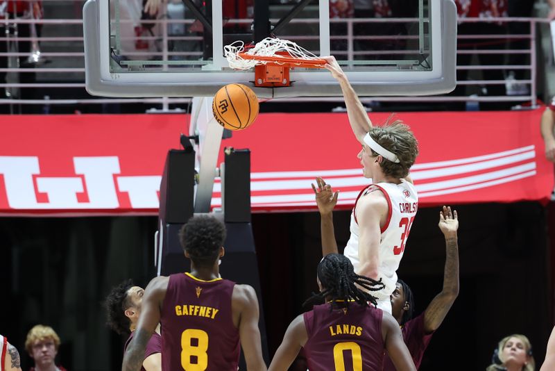 Feb 10, 2024; Salt Lake City, Utah, USA; Utah Utes center Branden Carlson (35) dunks the ball against the Arizona State Sun Devils during the first half at Jon M. Huntsman Center. Mandatory Credit: Rob Gray-USA TODAY Sports