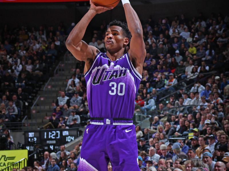 SALT LAKE CITY, UT - JANUARY 1:  Ochai Agbaji #30 of the Utah Jazz shoots a three point basket during the game against the Detroit Pistons on January 1, 2024 at vivint.SmartHome Arena in Salt Lake City, Utah. NOTE TO USER: User expressly acknowledges and agrees that, by downloading and or using this Photograph, User is consenting to the terms and conditions of the Getty Images License Agreement. Mandatory Copyright Notice: Copyright 2023 NBAE (Photo by Melissa Majchrzak/NBAE via Getty Images)