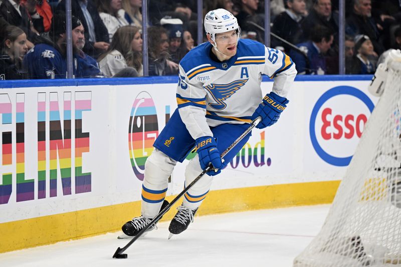 Nov 18, 2025; Toronto, Ontario, CAN; St. Louis Blues defenseman Colton Parayko (55) skates with the puck against the Toronto Maple Leafs in the third period at Scotiabank Arena. Mandatory Credit: Dan Hamilton-Imagn Images