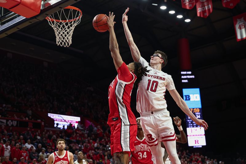 Mar 10, 2024; Piscataway, New Jersey, USA; Ohio State Buckeyes forward Devin Royal (21) rebounds in front of Rutgers Scarlet Knights guard Gavin Griffiths (10) during the second half at Jersey Mike's Arena. Mandatory Credit: Vincent Carchietta-USA TODAY Sports