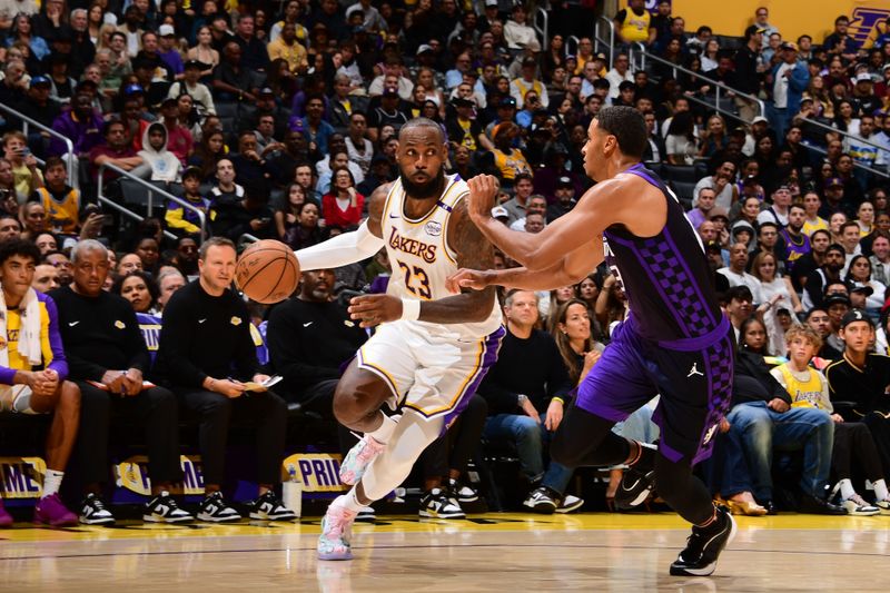 LOS ANGELES, CA - OCTOBER 26: LeBron James #23 of the Los Angeles Lakers drives to the basket during the game against the Sacramento Kings on October 26, 2024 at Crypto.Com Arena in Los Angeles, California. NOTE TO USER: User expressly acknowledges and agrees that, by downloading and/or using this Photograph, user is consenting to the terms and conditions of the Getty Images License Agreement. Mandatory Copyright Notice: Copyright 2024 NBAE (Photo by Adam Pantozzi/NBAE via Getty Images)