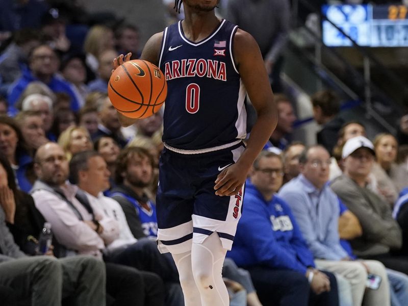 Jan 26, 2026; Provo, Utah, USA; Arizona Wildcats guard Jaden Bradley (0) dribbles the ball during the second half against the BYU Cougars at Marriott Center. Mandatory Credit: Aaron Baker-Imagn Images 