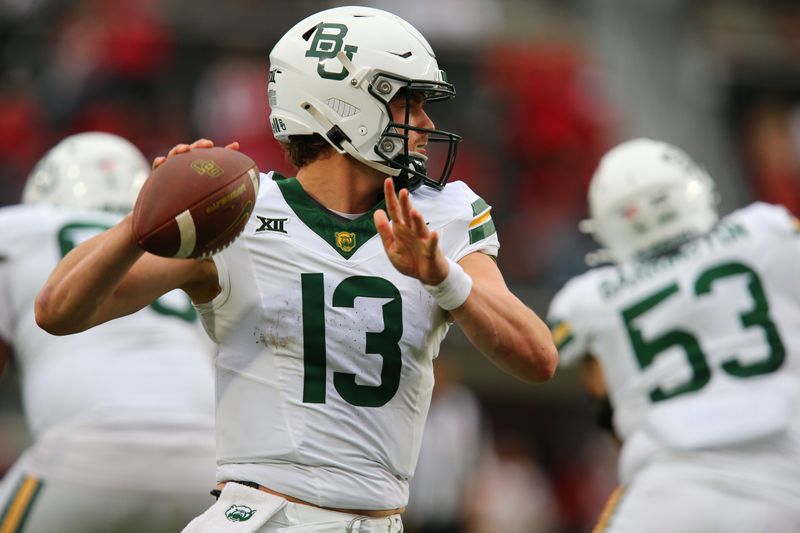 Oct 19, 2024; Lubbock, Texas, USA;  Baylor Bears quarterback Sawyer Robertson (13) throws against the Texas Tech Red Raiders in the second half at Jones AT&T Stadium and Cody Campbell Field. Mandatory Credit: Michael C. Johnson-Imagn Images