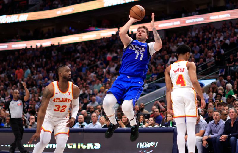 DALLAS, TX - APRIL 04: Luka Doncic #77 of the Dallas Mavericks attempts a three point basket against the Atlanta Hawks in the second half at American Airlines Center on April 4, 2024 in Dallas, Texas. NOTE TO USER: User expressly acknowledges and agrees that, by downloading and or using this photograph, User is consenting to the terms and conditions of the Getty Images License Agreement. (Photo by Ron Jenkins/Getty Images)