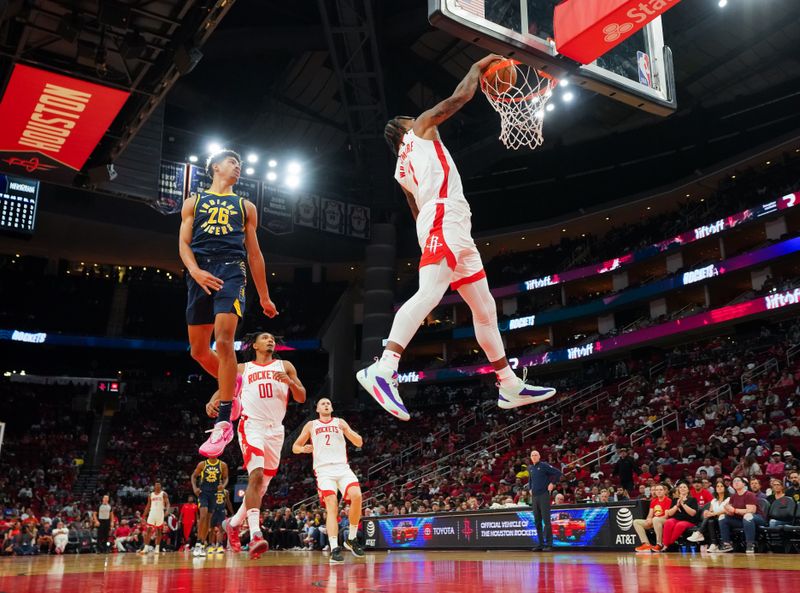 HOUSTON, TEXAS - OCTOBER 10: Cam Whitmore #7 of the Houston Rockets dunks the ball as Ben Sheppard #26 of the Indiana Pacers looks on during the third quarter of the preseason game at Toyota Center on October 10, 2023 in Houston, Texas. NOTE TO USER: User expressly acknowledges and agrees that, by downloading and or using this photograph, User is consenting to the terms and conditions of the Getty Images License Agreement. (Photo by Alex Bierens de Haan/Getty Images)