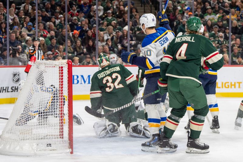 Jan 7, 2025; Saint Paul, Minnesota, USA; St. Louis Blues center Brayden Schenn (10) celebrates a goal scored by left wing Pavel Buchnevich (89) in front of Minnesota Wild goaltender Filip Gustavsson (32) in the first period at Xcel Energy Center. Mandatory Credit: Matt Blewett-Imagn Images