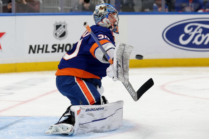 Jan 24, 2025; Elmont, New York, USA; New York Islanders goaltender Ilya Sorokin (30) makes a save against the Philadelphia Flyers during the third period at UBS Arena. Mandatory Credit: Brad Penner-Imagn Images