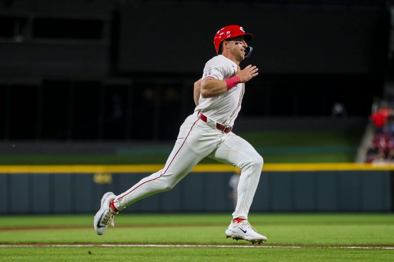 Apr 9, 2024; Cincinnati, Ohio, USA; Cincinnati Reds outfielder Spencer Steer (7) runs home on a two-run double hit by catcher Tyler Stephenson (not pictured) in the seventh inning against the Milwaukee Brewers at Great American Ball Park. Mandatory Credit: Katie Stratman-USA TODAY Sports