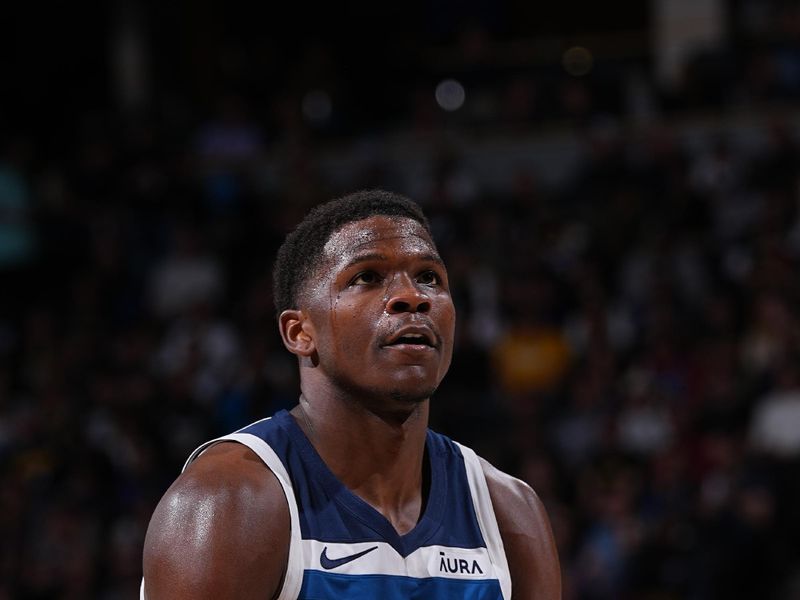 DENVER, CO - APRIL 10: Anthony Edwards #5 of the Minnesota Timberwolves shoots a free throw during the game against the Denver Nuggets on April 10, 2024 at the Ball Arena in Denver, Colorado. NOTE TO USER: User expressly acknowledges and agrees that, by downloading and/or using this Photograph, user is consenting to the terms and conditions of the Getty Images License Agreement. Mandatory Copyright Notice: Copyright 2024 NBAE (Photo by Bart Young/NBAE via Getty Images)