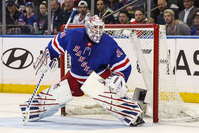 Apr 15, 2024; New York, New York, USA;  New York Rangers goaltender Igor Shesterkin (31) defends the net in the second period against the Ottawa Senators at Madison Square Garden. Mandatory Credit: Wendell Cruz-USA TODAY Sports