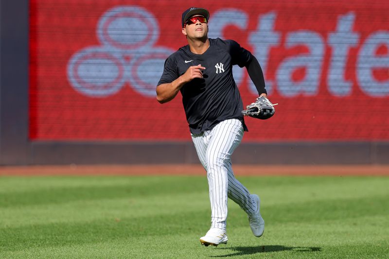 Aug 22, 2023; Bronx, New York, USA; New York Yankees left fielder Everson Pereira (80) tracks a fly ball during batting practice before a game against the Washington Nationals at Yankee Stadium. Mandatory Credit: Brad Penner-USA TODAY Sports