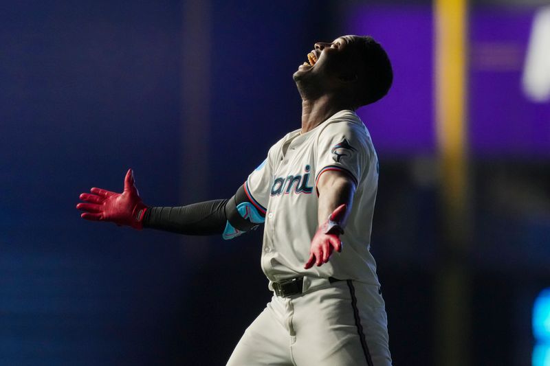 May 2, 2024; Miami, Florida, USA;  Miami Marlins right fielder Jesús Sánchez (12) celebrates the game winning hit in the tenth inning against the Colorado Rockies at loanDepot Park. Mandatory Credit: Jim Rassol-USA TODAY Sports