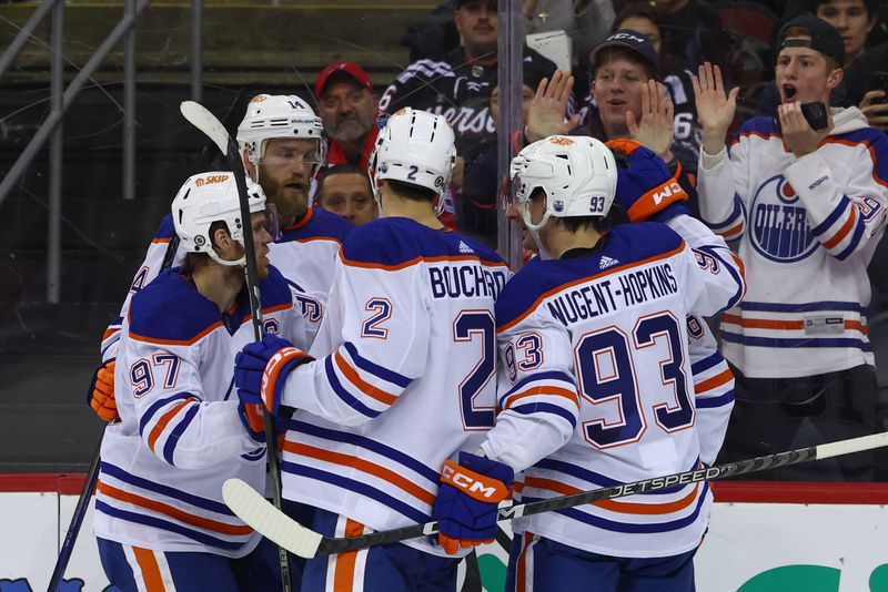 Dec 21, 2023; Newark, New Jersey, USA; Edmonton Oilers center Connor McDavid (97) celebrates his goal against the New Jersey Devils during the third period at Prudential Center. Mandatory Credit: Ed Mulholland-USA TODAY Sports