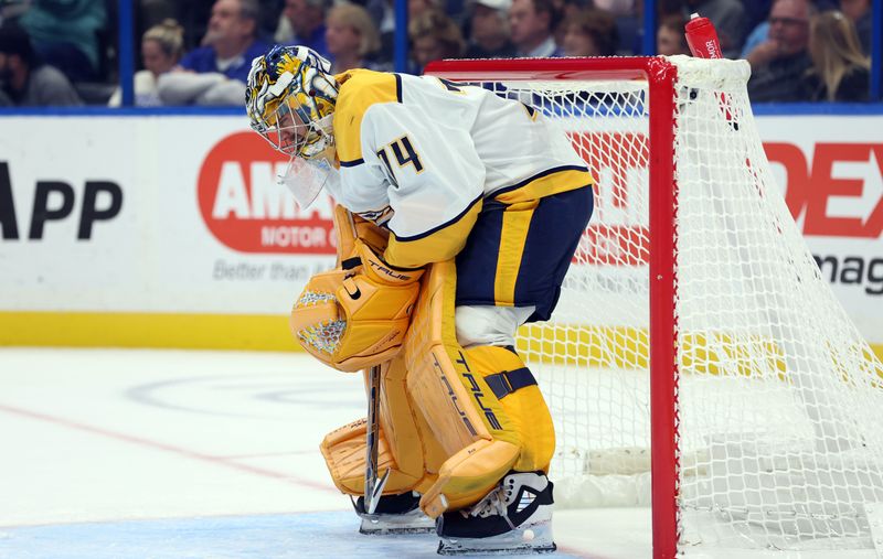 Oct 28, 2024; Tampa, Florida, USA; Nashville Predators goaltender Juuse Saros (74) looks on against the Tampa Bay Lightning during the first period at Amalie Arena. Mandatory Credit: Kim Klement Neitzel-Imagn Images