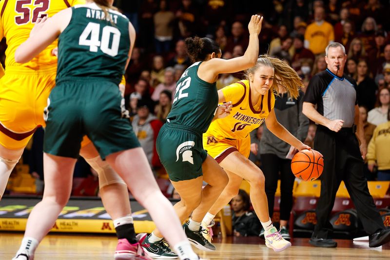 Jan 20, 2024; Minneapolis, Minnesota, USA; Minnesota Golden Gophers guard Mara Braun (10) works up court as Michigan State Spartans guard Moira Joiner (22) defends during the first half at Williams Arena. Mandatory Credit: Matt Krohn-USA TODAY Sports