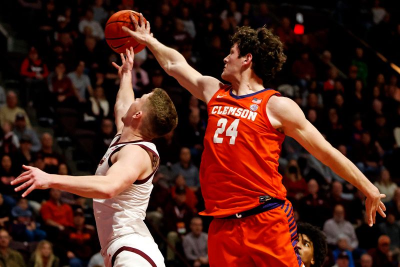 Jan 10, 2024; Blacksburg, Virginia, USA; Clemson Tigers center PJ Hall (24) block the shot of Virginia Tech Hokies guard Sean Pedulla (3) during the second half at Cassell Coliseum. Mandatory Credit: Peter Casey-USA TODAY Sports