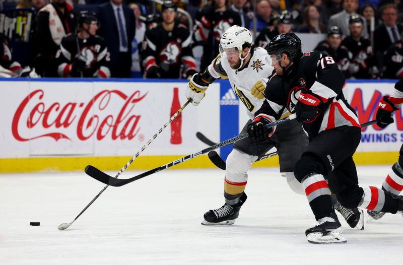 Mar 2, 2024; Buffalo, New York, USA;  Vegas Golden Knights center Paul Cotter (43) and Buffalo Sabres defenseman Connor Clifton (75) go after a loose puck during the third period at KeyBank Center. Mandatory Credit: Timothy T. Ludwig-USA TODAY Sports