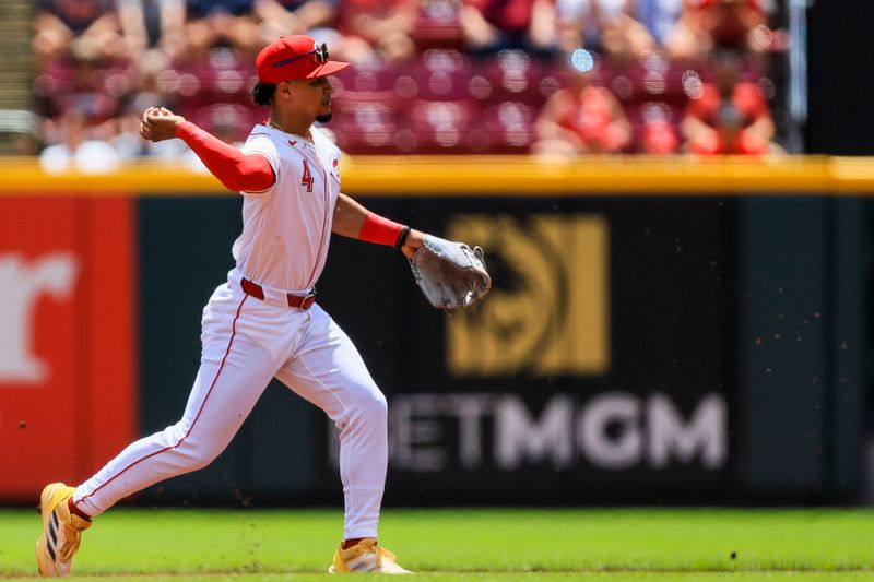 Jul 7, 2024; Cincinnati, Ohio, USA; Cincinnati Reds second baseman Santiago Espinal (4) throws to first to get Detroit Tigers outfielder Wenceel Perez (not pictured) out in the first inning at Great American Ball Park. Mandatory Credit: Katie Stratman-USA TODAY Sports