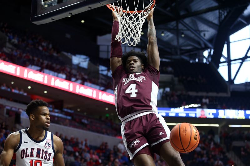 Feb 18, 2023; Oxford, Mississippi, USA; Mississippi State Bulldogs guard/forward Cameron Matthews (4) dunks during the first half against the Mississippi Rebels at The Sandy and John Black Pavilion at Ole Miss. Mandatory Credit: Petre Thomas-USA TODAY Sports