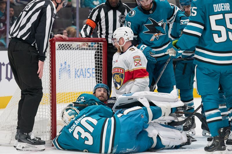 Jan 25, 2025; San Jose, California, USA; Florida Panthers center Sam Bennett (9) talks with San Jose Sharks right wing Barclay Goodrow (23) in the goal crease during the third period at SAP Center at San Jose. Mandatory Credit: Robert Edwards-Imagn Images