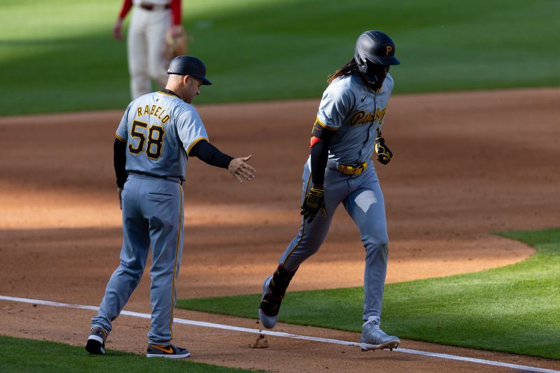 Apr 13, 2024; Philadelphia, Pennsylvania, USA; Pittsburgh Pirates shortstop Oneil Cruz (15) high fives third base coach Mike Rabelo (58) while running the bases after hitting a two RBI home run during the fifth inning against the Philadelphia Phillies at Citizens Bank Park. Mandatory Credit: Bill Streicher-USA TODAY Sports