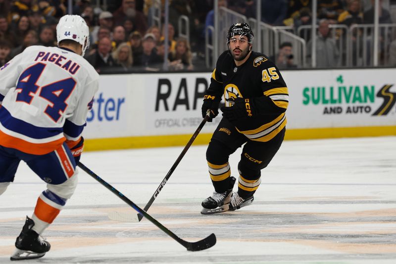 Oct 28, 2025; Boston, Massachusetts, USA; Boston Bruins defenseman Jonathan Aspirot (45) keeps an eye on New York Islanders center Jean-Gabriel Pageau (44) during the second period at TD Garden. Mandatory Credit: Winslow Townson-Imagn Images