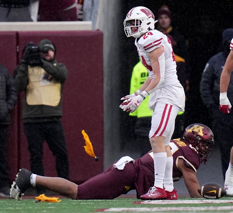 Nov 25, 2023; Minneapolis, Minnesota, USA; Wisconsin Badgers safety Hunter Wohler (24) is called for pass interference against the Minnesota Golden Gophers during the second quarter at Huntington Bank Stadium. Mandatory Credit: Mark Hoffman/Milwaukee Journal Sentinel via USA TODAY NETWORK