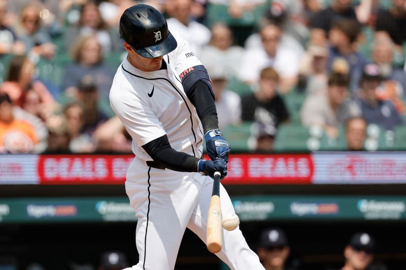 May 15, 2024; Detroit, Michigan, USA;  Detroit Tigers outfielder Mark Canha (21) hits a single in the eighth inning against the Miami Marlins at Comerica Park. Mandatory Credit: Rick Osentoski-USA TODAY Sports