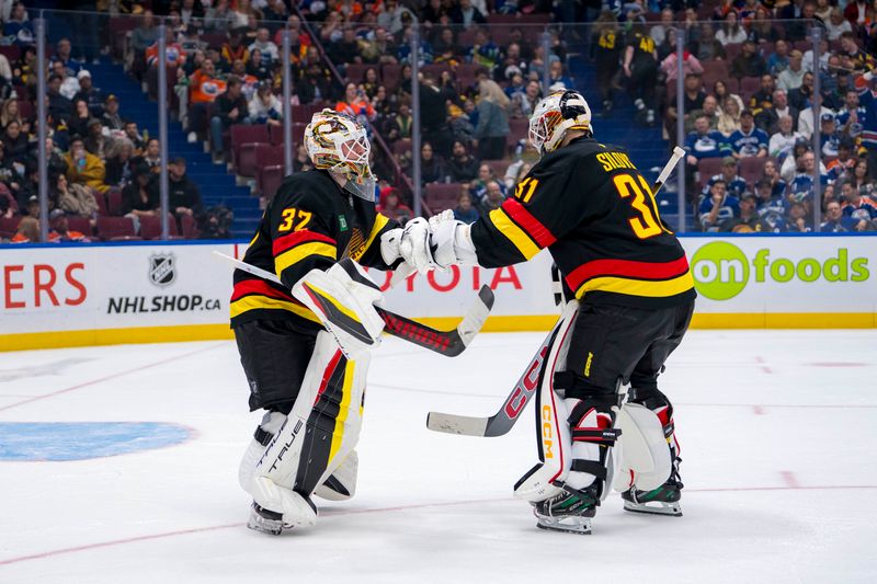 Nov 9, 2024; Vancouver, British Columbia, CAN; Vancouver Canucks goalie Arturs Silovs (31) replaces goalie Kevin Lankinen (32) in the net against the Edmonton Oilers during the third period at Rogers Arena. Mandatory Credit: Bob Frid-Imagn Images