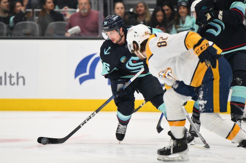 Mar 16, 2024; Seattle, Washington, USA; Seattle Kraken right wing Kailer Yamamoto (56) plays the puck during the first period against the Nashville Predators at Climate Pledge Arena. Mandatory Credit: Steven Bisig-USA TODAY Sports