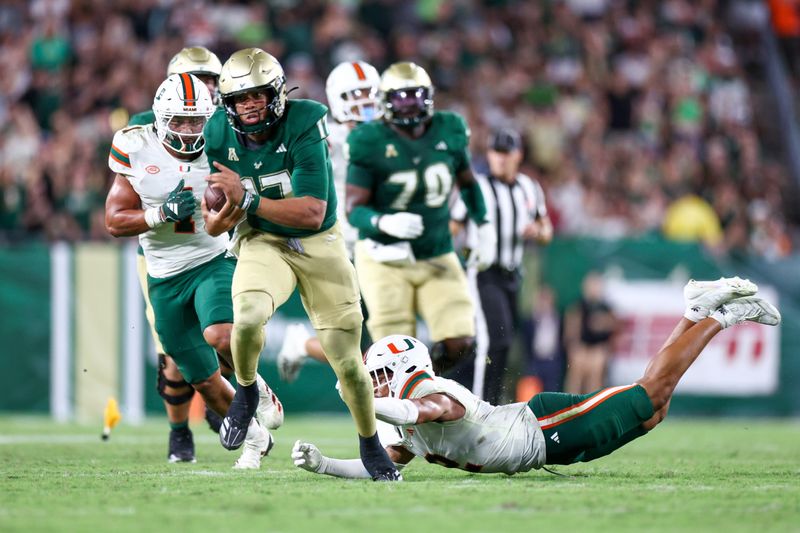 Sep 21, 2024; Tampa, Florida, USA; South Florida Bulls quarterback Byrum Brown (17) runs with the ball against the Miami Hurricanes in the third quarter  at Raymond James Stadium. Mandatory Credit: Nathan Ray Seebeck-Imagn Images