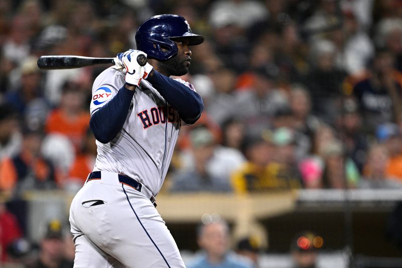 Sep 17, 2024; San Diego, California, USA; Houston Astros designated hitter Yordan Alvarez (44) hits a double against the San Diego Padres during the eighth inning at Petco Park. Mandatory Credit: Orlando Ramirez-Imagn Images