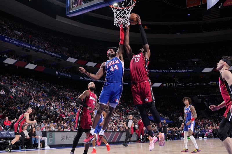 PHILADELPHIA, PA - FEBRUARY 14: Bam Adebayo #13 of the Miami Heat rebounds the ball during the game against the Philadelphia 76ers on February 14, 2024 at the Wells Fargo Center in Philadelphia, Pennsylvania NOTE TO USER: User expressly acknowledges and agrees that, by downloading and/or using this Photograph, user is consenting to the terms and conditions of the Getty Images License Agreement. Mandatory Copyright Notice: Copyright 2024 NBAE (Photo by Jesse D. Garrabrant/NBAE via Getty Images)