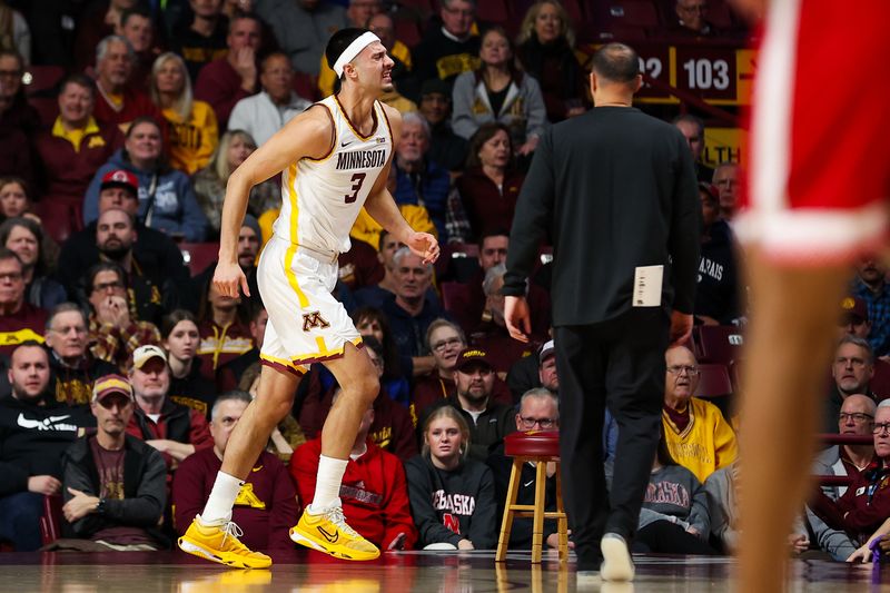 Dec 6, 2023; Minneapolis, Minnesota, USA; Minnesota Golden Gophers forward Dawson Garcia (3) runs off the court with an injury during the first half against the Nebraska Cornhuskers at Williams Arena. Mandatory Credit: Matt Krohn-USA TODAY Sports