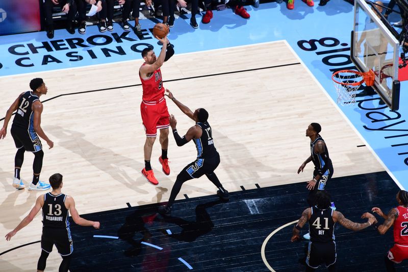 ATLANTA, GA - FEBRUARY 12: Nikola Vucevic #9 of the Chicago Bulls shoots the ball during the game  on February 12, 2024 at State Farm Arena in Atlanta, Georgia.  NOTE TO USER: User expressly acknowledges and agrees that, by downloading and/or using this Photograph, user is consenting to the terms and conditions of the Getty Images License Agreement. Mandatory Copyright Notice: Copyright 2024 NBAE (Photo by Scott Cunningham/NBAE via Getty Images)